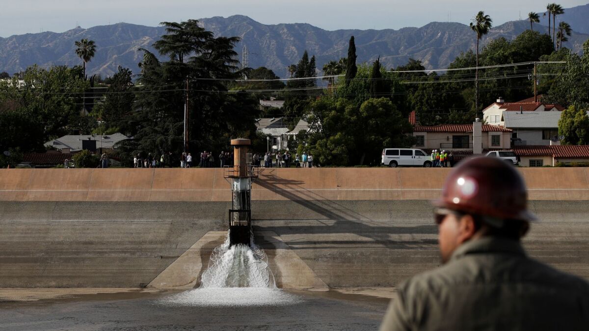 Water flows into the Silver Lake Reservoir Complex on April 25, two years after authorities drained the reservoirs.