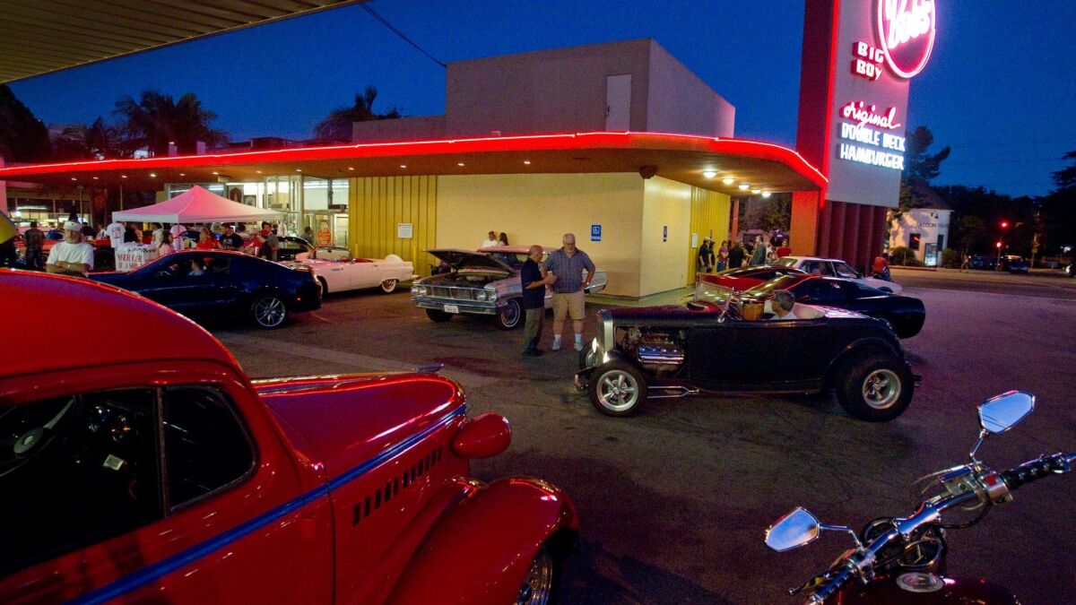 Classic car enthusiasts cruise and show off their cars in the parking lot of Bob's Big Boy restaurant in Toluca Lake in this Aug. 2013 file photo.