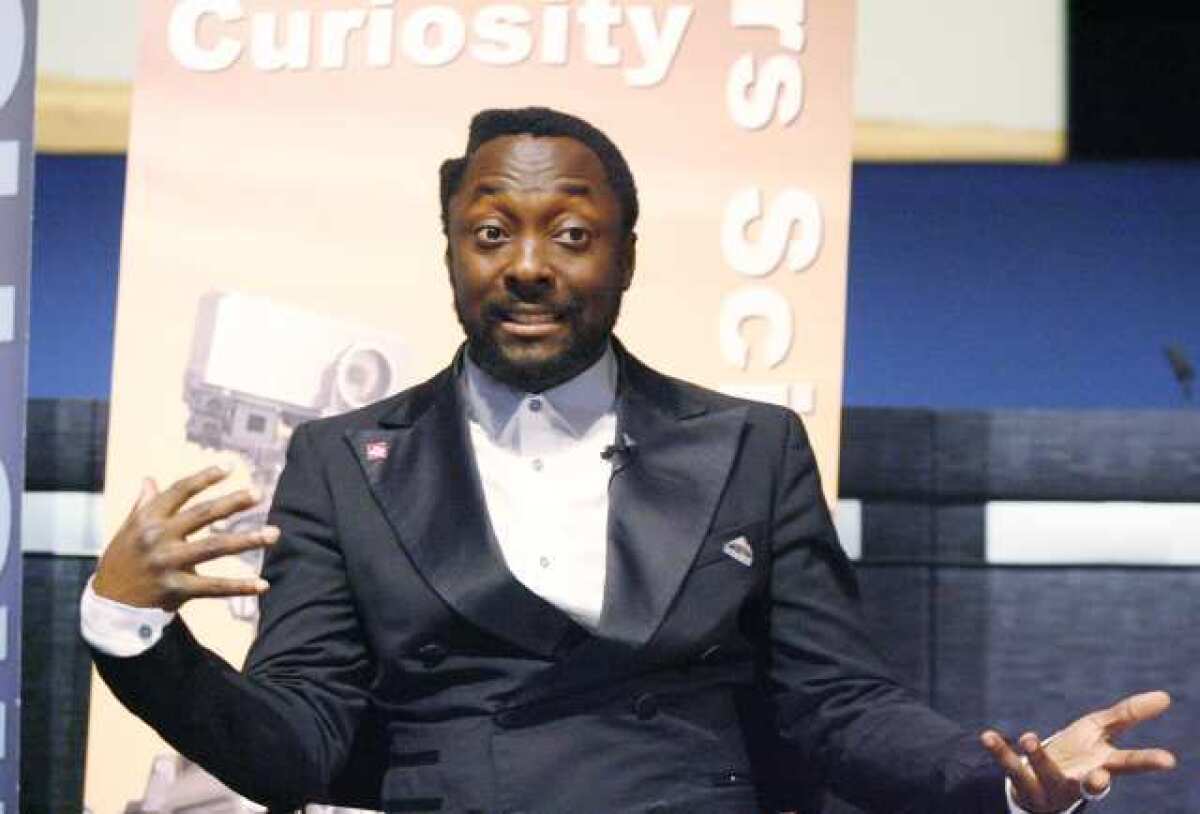 Musician will.i.am speaks at JPL the night the rover Curiosity touched down on Mars.