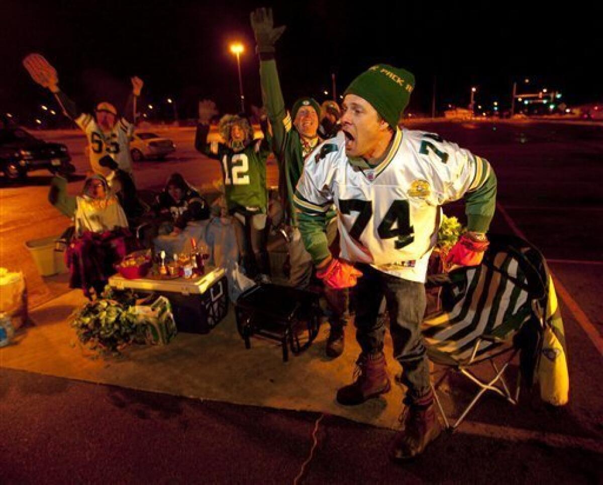 Cheesehead fans of the Green Bay Packers football team come out in droves  with their head gear and bratwursts to support the team in Green Bay,  Wisconsin - digital file from original