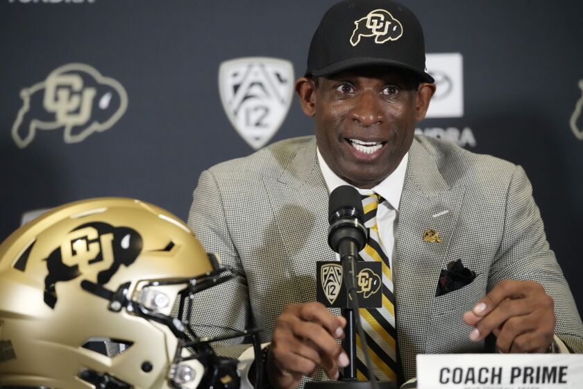 Deion Sanders speaks after being introduced as the new head NCAA college football coach at Colorado during a news conference Sunday, Dec. 4, 2022, in Boulder, Colo. (AP Photo/David Zalubowski)