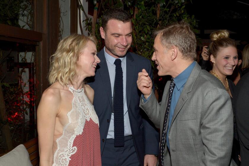 Actors Naomi Watts, Liev Schreiber and Christoph Waltz chat during the Audi Celebrates Golden Globes Week 2015 party.
