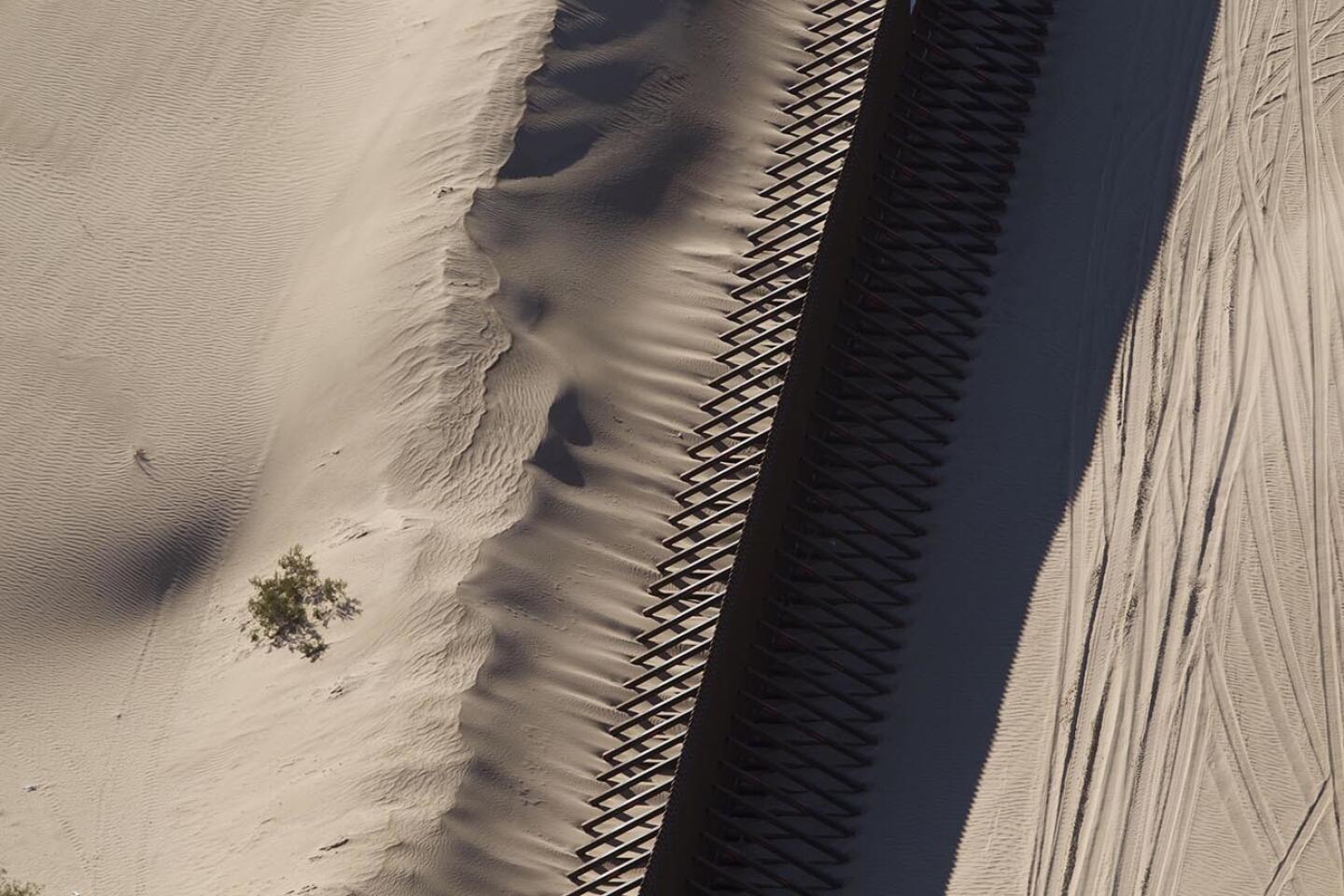 Fence, wind and sand