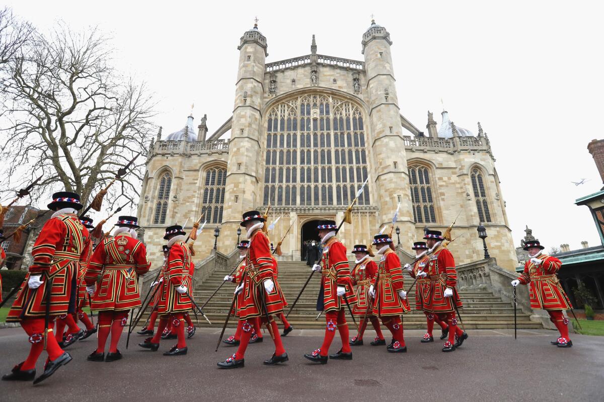 Yeomen of the Guard march outside St. George's Chapel after the Royal Maundy Service.