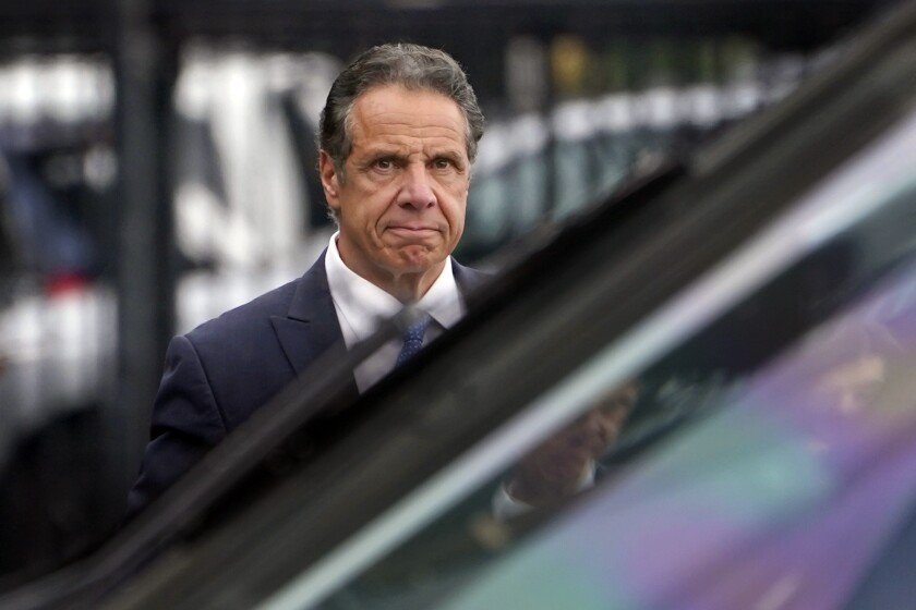 New York Gov. Andrew Cuomo prepares to board a helicopter after announcing his resignation, Tuesday, Aug. 10, 2021, in New York. Cuomo says he will resign over a barrage of sexual harassment allegations. The three-term Democratic governor's decision, which will take effect in two weeks, was announced as momentum built in the Legislature to remove him by impeachment. (AP Photo/Seth Wenig)