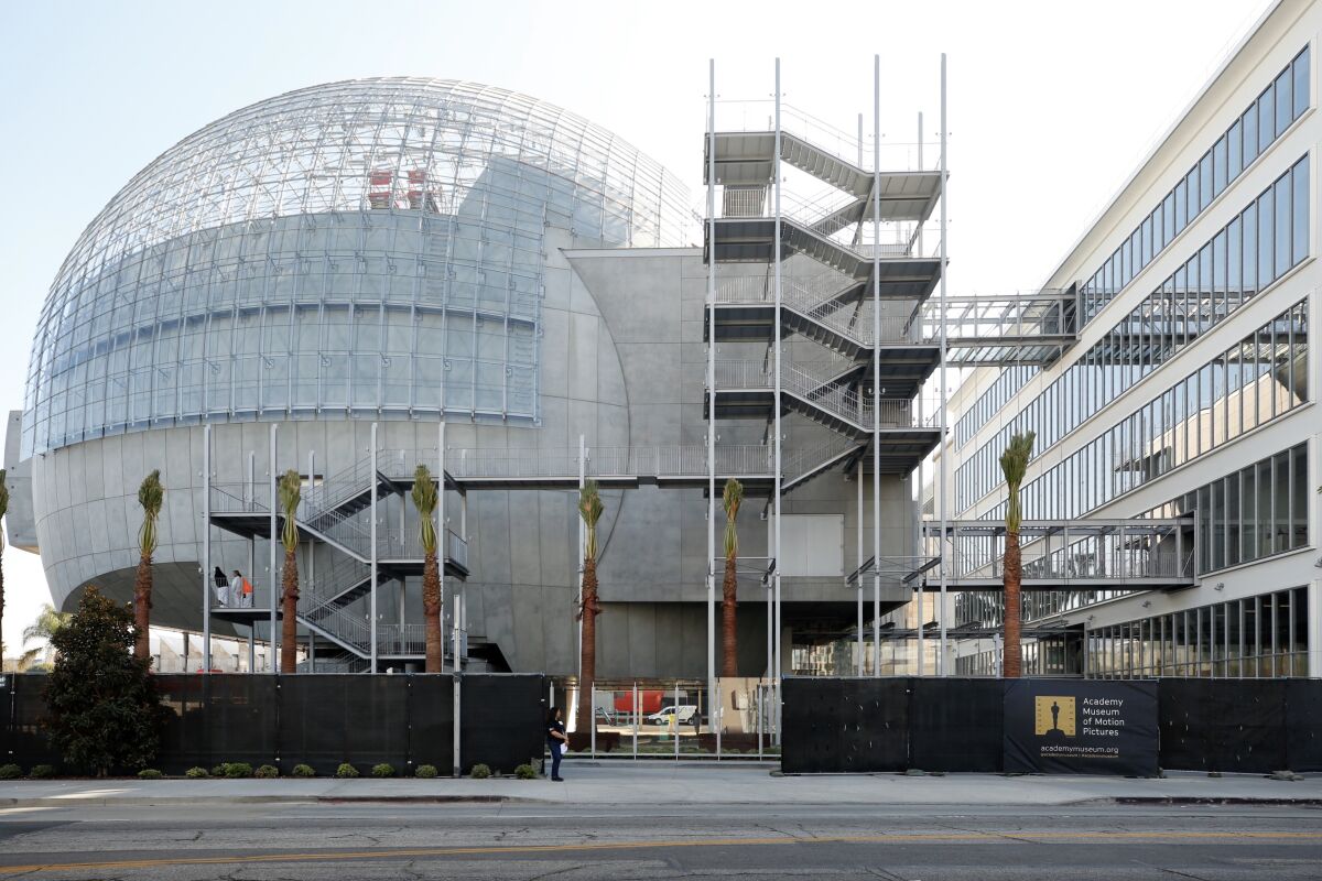 Renzo Piano's glass-topped concrete sphere, attached to the old May Co. building that holds the rest of the forthcoming Academy Museum.