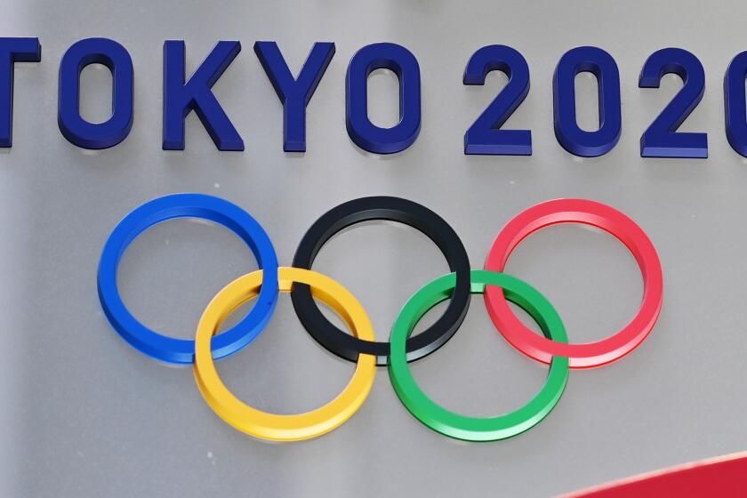 The logo for the Tokyo 2020 Olympic Games is seen in Tokyo on March 15, 2020. (Photo by CHARLY TRIBALLEAU / AFP) (Photo by CHARLY TRIBALLEAU/AFP via Getty Images)