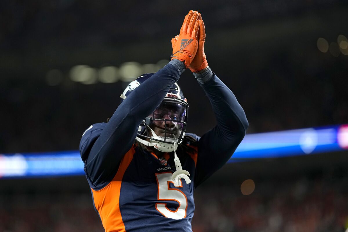 Denver Broncos linebacker Randy Gregory (5) gestures after San Francisco 49ers quarterback Jimmy Garoppolo was called for a safety during the second half of an NFL football game in Denver, Sunday, Sept. 25, 2022. (AP Photo/Jack Dempsey)