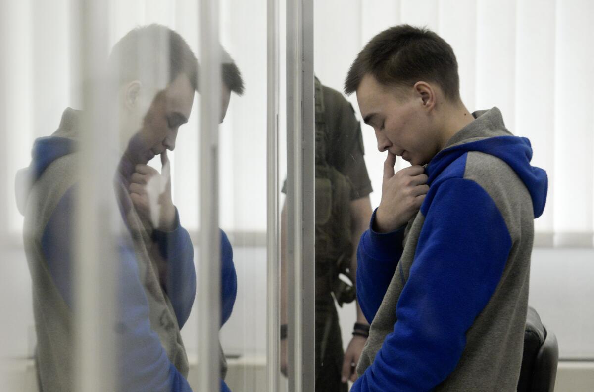 Russian army Sgt. Vadim Shishimarin is seen behind a glass during a court hearing.