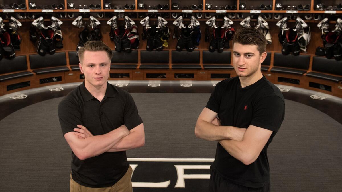 Gabriel Vilardi, right, is the Kings' top forward prospect. He is shown in the locker room at the team's El Segundo practice facility with fellow rookie Jaret Anderson-Dolan.