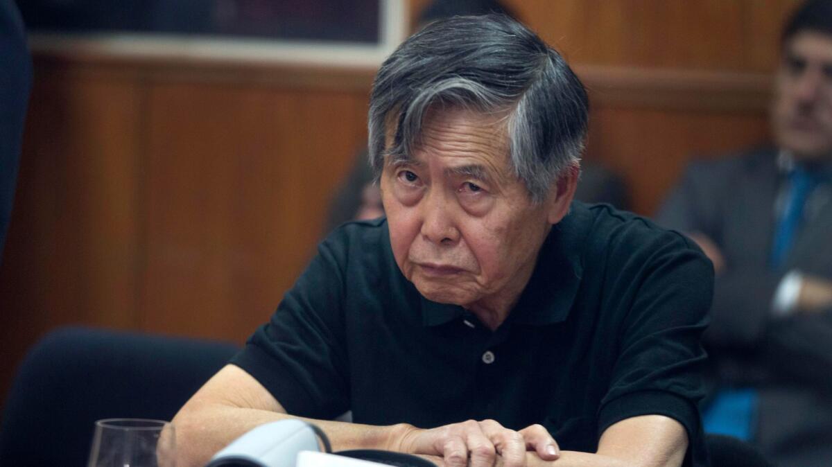 Former President Alberto Fujimori is shown during a hearing at a police base on the outskirts of Lima, Peru, in 2013.