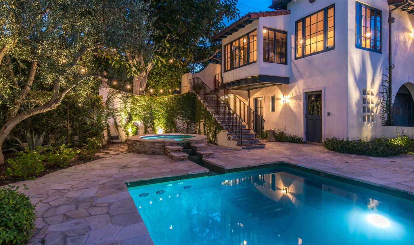 The patio and pool next to the house.