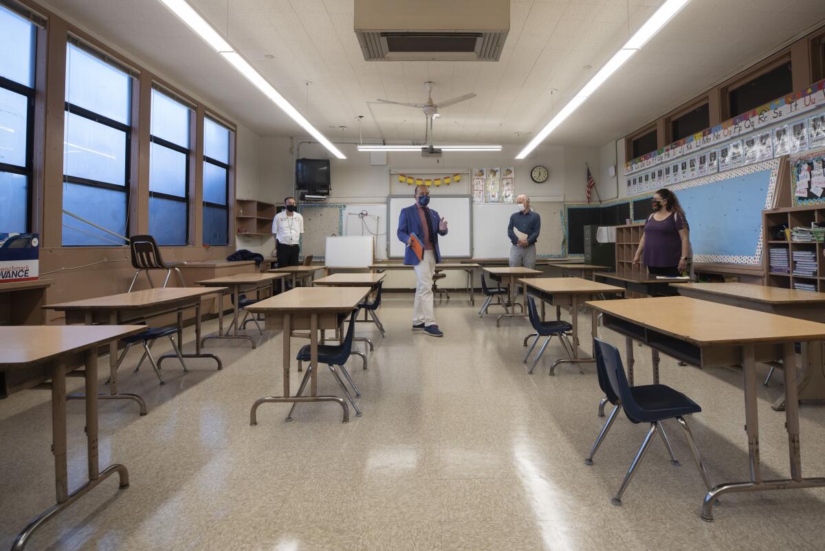 Jacinto Zavala, principal of Suva Elementary School in Bell Gardens, shows the layout of a first-grade classroom. 