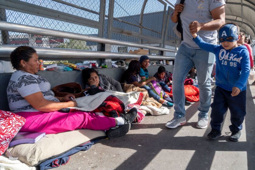 Migrants wait to declare asylum in El Paso.