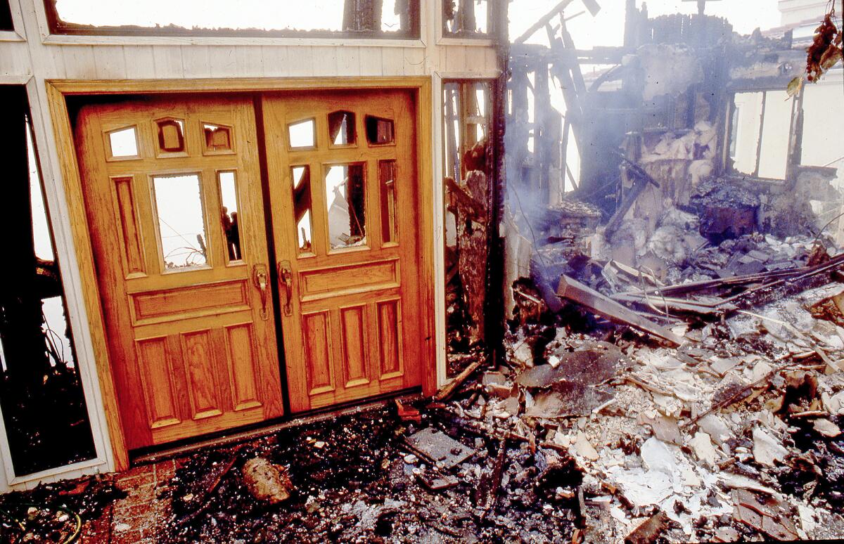 The front doors of a burned out home on Tahiti Avenue in Laguna Beach's Mystic Hills neighborhood in 1993.