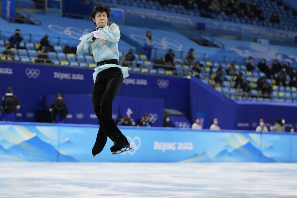 Yuzuru Hanyu, of Japan, competes in the men's free skate program during the figure skating event at the 2022 Winter Olympics, Thursday, Feb. 10, 2022, in Beijing. (AP Photo/Natacha Pisarenko)