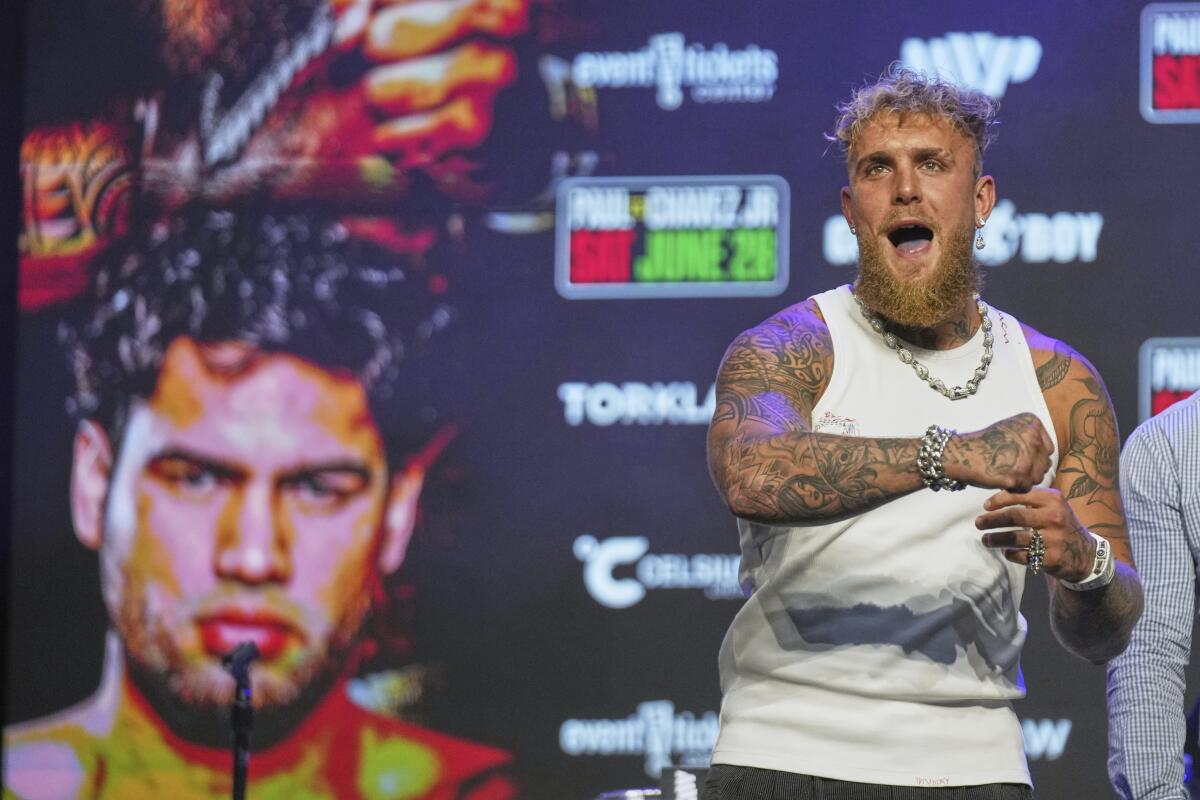Boxer Jake Paul gestures after challenging J