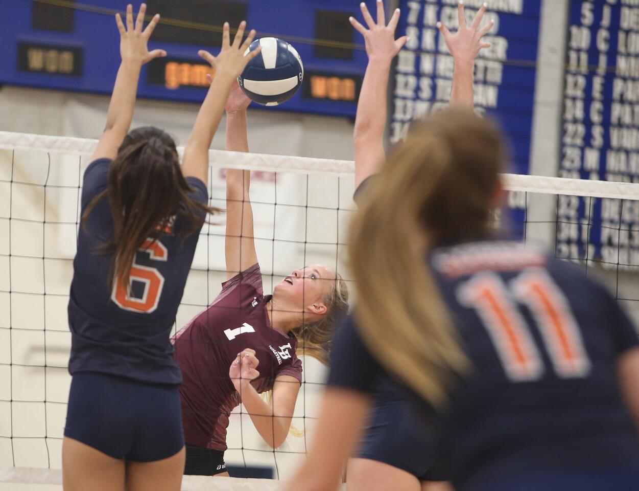 Laguna Beach High's Jacquelyn Strawn hits a kill in the semifinals of the CIF Southern Section Division 3 playoffs against Cypress on Saturday.