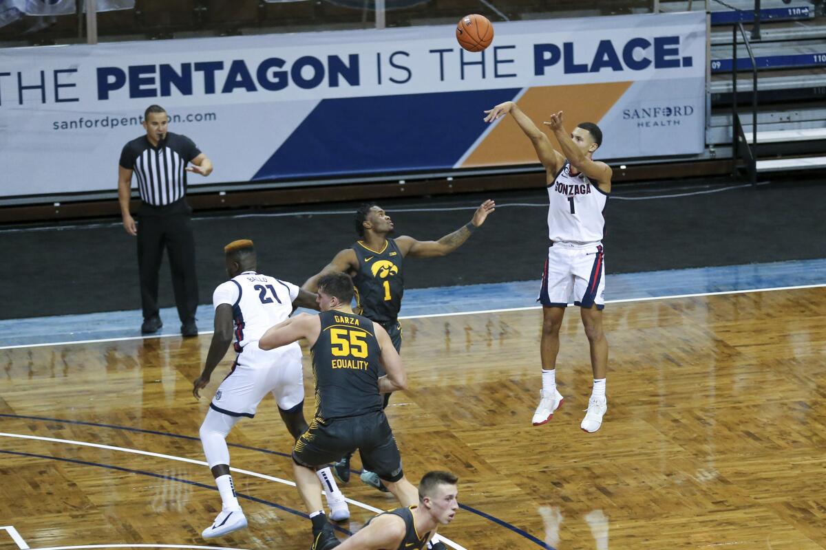 Gonzaga guard Jalen Suggs shoots a three-pointer during the first half Saturday against Iowa on Dec. 19, 2020.