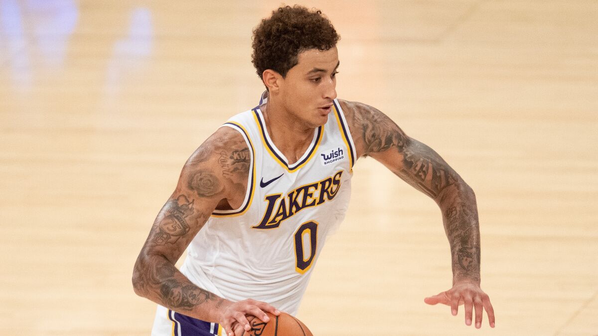 Lakers forward Kyle Kuzma drives to the basket during a preseason game against the Clippers on Dec. 11.