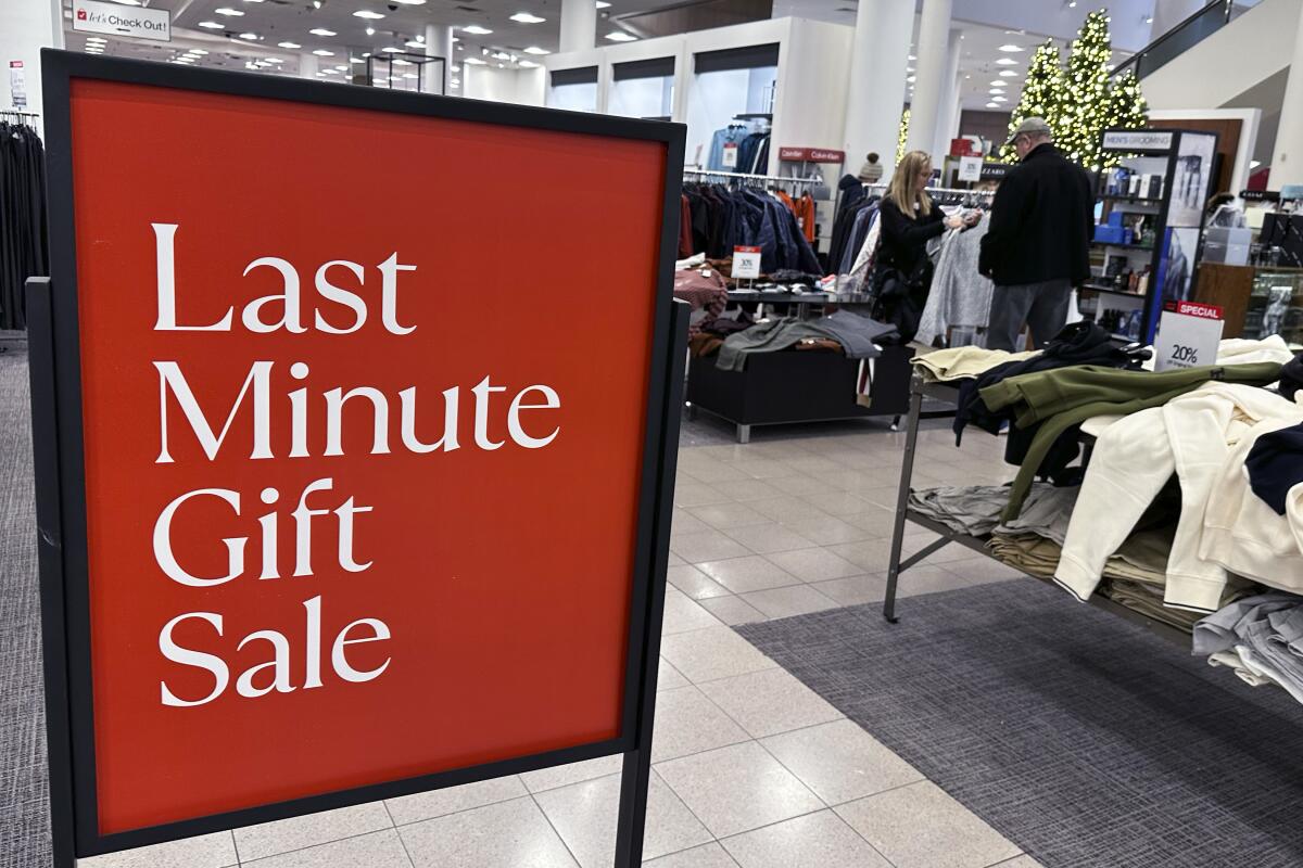 A sign aimed at last-minute holiday shoppers is displayed at a retail store.