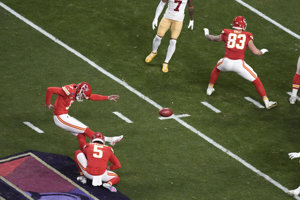 Harrison Butker kicks a field goal for the Chiefs against the 49ers in the first half.