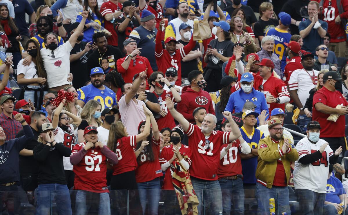 Fans of the 49ers cheer during San Francisco's overtime win over the Rams at SoFi Stadium on Jan. 9.