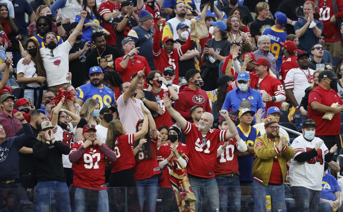 A throng of 49ers fans cheer in SoFi Stadium in game against the hometown Rams.