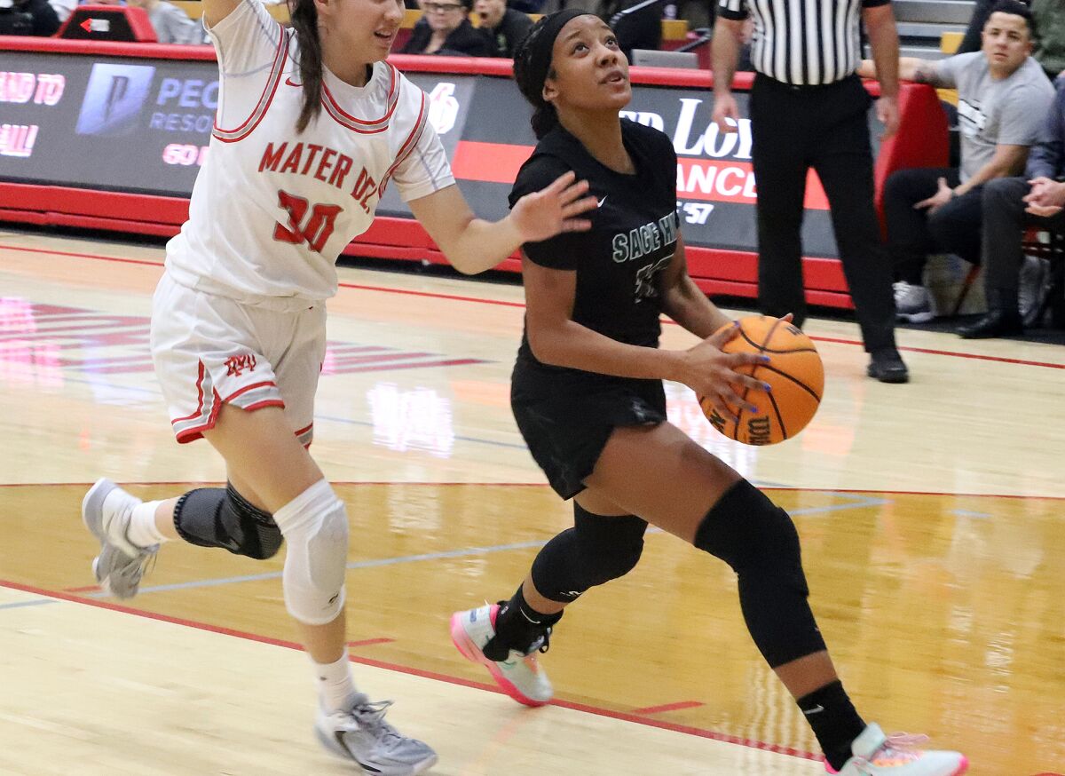 Sage Hill's Zoie Lamkin (13) drives for a layup against Mater Dei in the Matt Denning Nike Hoops Classic on Saturday.
