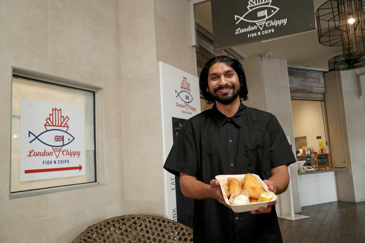 Chef and co-owner Arjun Neil Bhakta, 32, poses for a portrait at London Chippy, in the food hall at TRADE Marketplace.