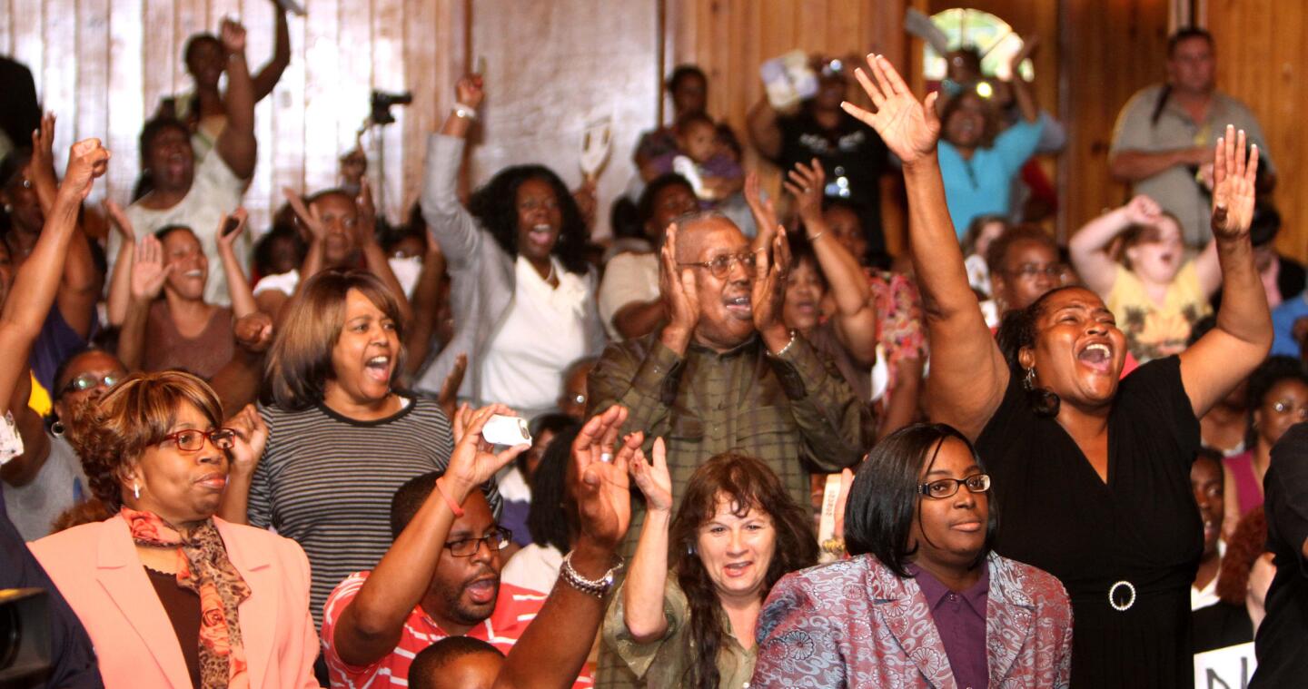 Protesters at the Allen Chapel AME Church in Sanford, Fla., Tuesday night, March 20, 2012, where a meeting hosted by the NAACP was being held to address community concerns in the shooting of Trayvon Martin.