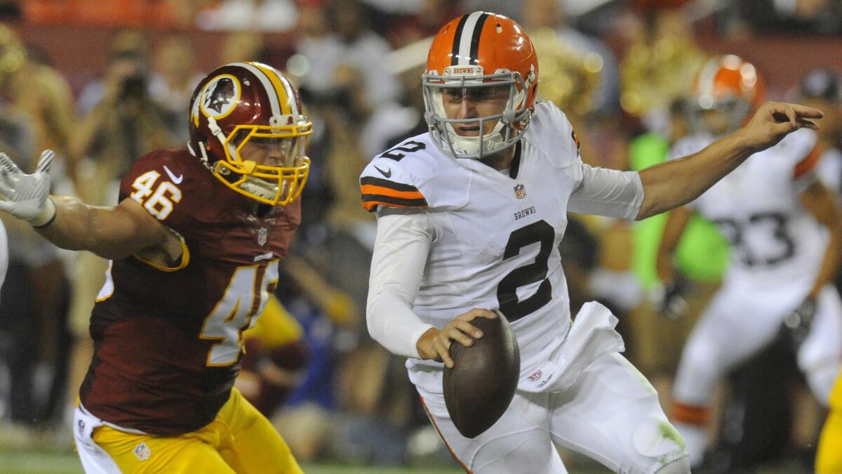 Washington Redskins inside linebacker Will Compton, left, chases Cleveland Browns quarterback Johnny Manziel during the second half of a preseason game on Monday.