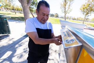 Palmdale, CA - October 20: Palmdale resident Victor Roche deposits his ballot in a drop box at Domenic Massari Park on Sunday, Oct. 20, 2024 in Palmdale, CA. (Brian van der Brug / Los Angeles Times)