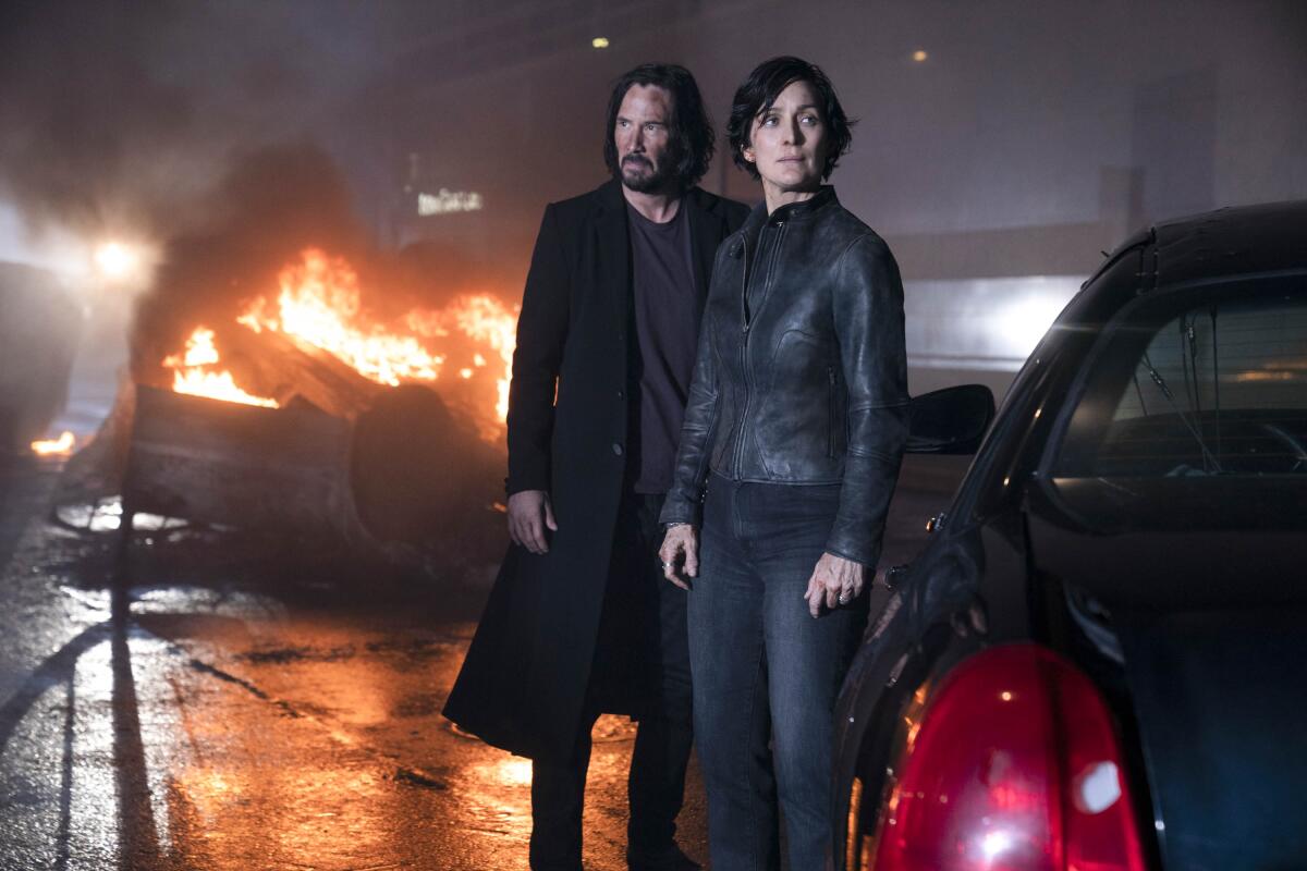 Keanu Reeves and Carrie-Anne Moss in “The Matrix Resurrections”