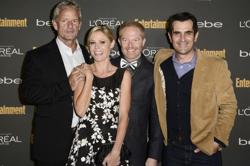 From left, "Modern Family" co-creator Christopher Lloyd and stars Julie Bowen, Jesse Tyler Ferguson and Ty Burrell arrive at Entertainment Weekly's pre-Emmy party.