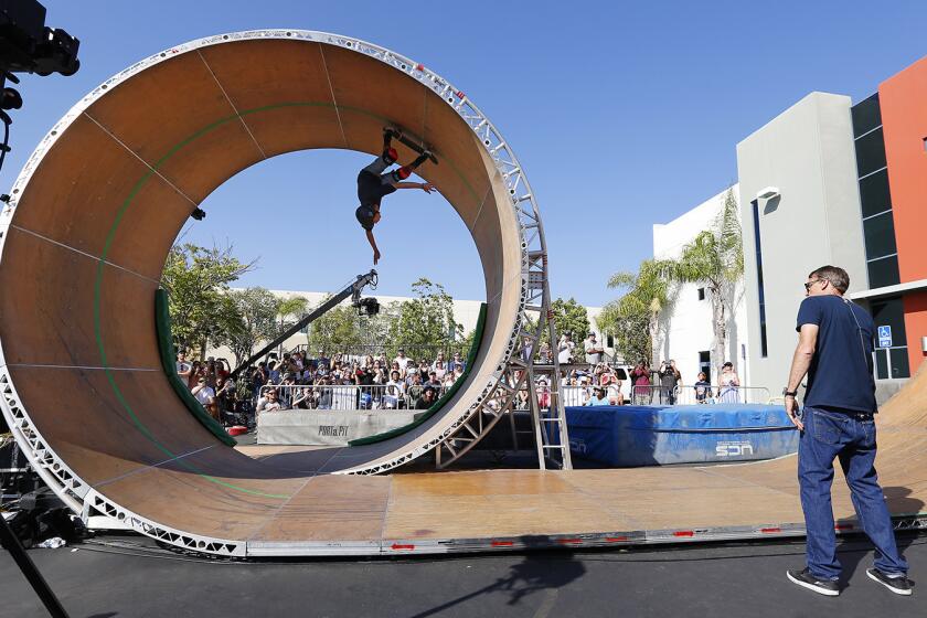 Skateboarder Jeromy Green successfully completes the Tony Hawk's Loop Challenge Live in Vista on August 26, 2018. Green was the first of two skateboarders to make it around the nearly 16-foot tall loop as Hawk, right, looks on. (Photo by K.C. Alfred/San Diego Union-Tribune)