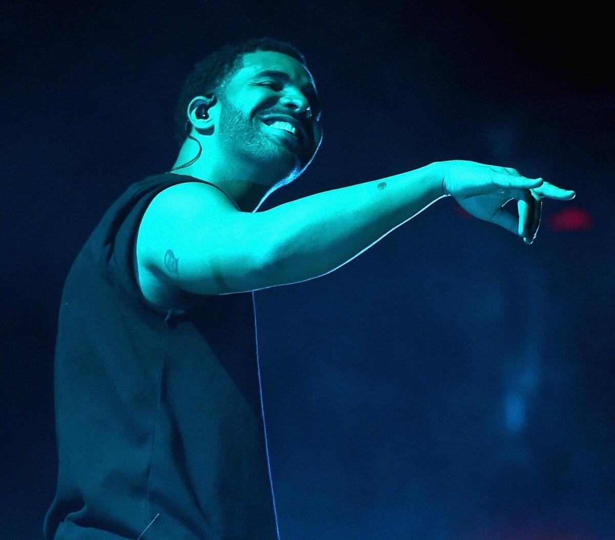 Rapper Drake, performing at the 2015 Coachella Valley Music & Arts Festival in Indio, has scored the No. 1 album for his collaboration with rapper Future and logged his 100th single on the Billboard Hot 100 chart.