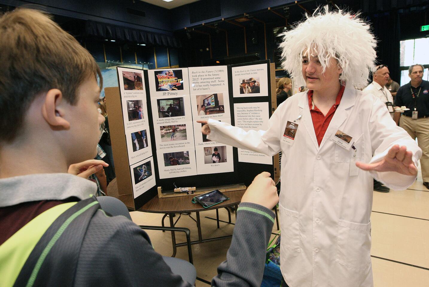 Mountain Ave. Elementary student Joshua Pitney, 13, discusses the theory of time travel as seen in the movie "Back to the Future" during the L.A. County Science Fair at NASA's Jet Propulsion Laboratory on Tuesday, April 14, 2015.