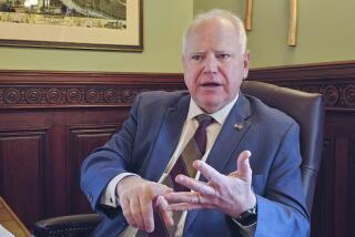 FILE - Minnesota Gov. Tim Walz discusses the upcoming 2024 legislative session during an interview at his office in the state Capitol, Feb. 7, 2024. (AP Photo/Steve Karnowski, File)