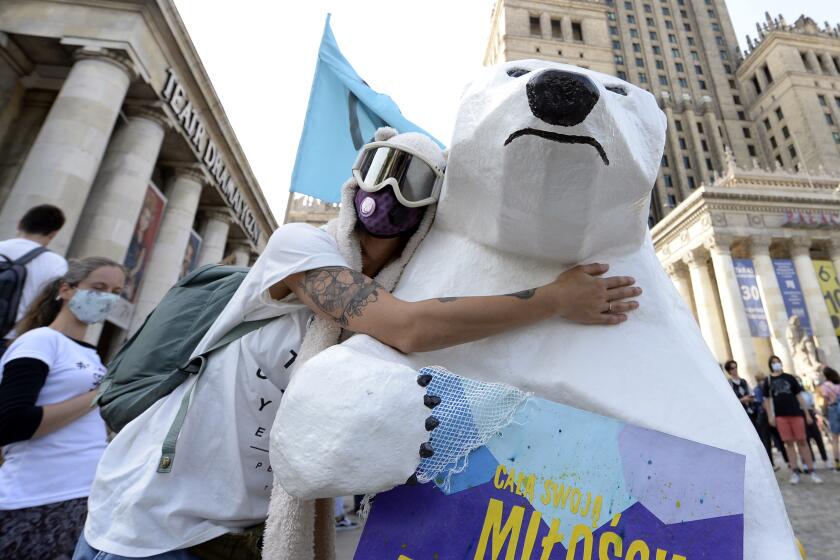 Young people take part in global climate protest in Warsaw, Poland, Friday, Sept. 25, 2020.(AP Photo/Czarek Sokolowski)