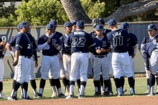 Birmingham coach Matt Mowry talks to his players after a 9-1 win over El Camino Real.