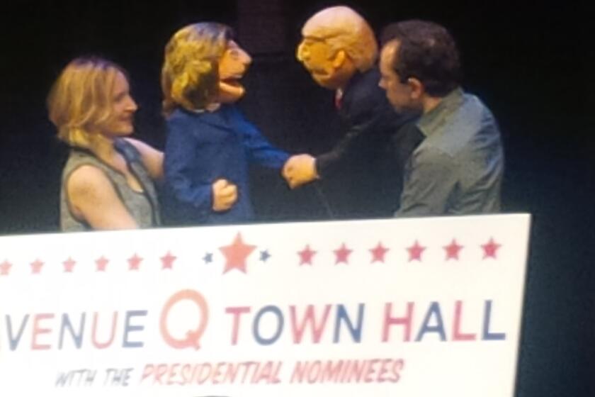 Maggie Lakis as Hillary Clinton and Rob McClure as Donald Trump in the "Avenue Q Town Hall" on Monday in New York.