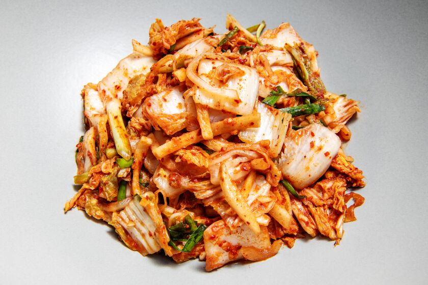 LOS ANGELES , CA - SEPTEMBER 29: Mak kimchi recipe by Haejung Kim at Kim's residence on Tuesday, Sept. 29, 2020 in Los Angeles , CA. (Mariah Tauger / Los Angeles Times)