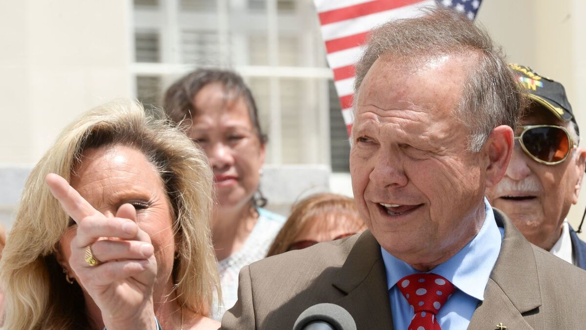 Suspended Alabama Chief Justice Roy Moore announces his plan to run for U.S. Senate during a Wednesday news conference on the steps of the Capitol in Montgomery.
