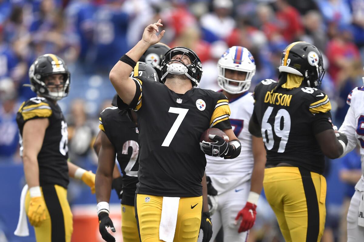 Pittsburgh Steelers quarterback Ben Roethlisberger (7) begins to celebrate as time runs out in a 23-16 Steelers win over the Buffalo Bills in an NFL football game in Orchard Park, N.Y., Sunday, Sept. 12, 2021. (AP Photo/Adrian Kraus)