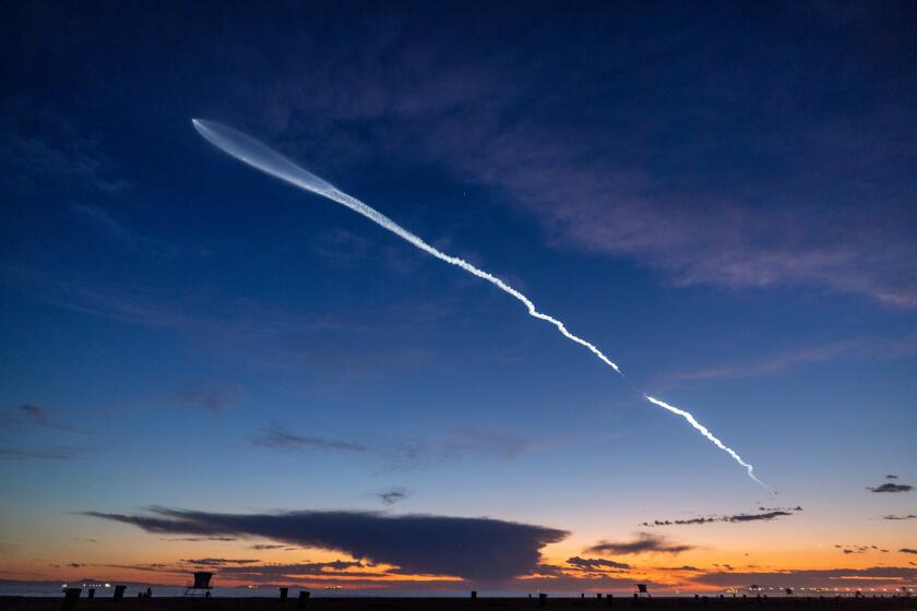 Huntington Beach, CA - March 18: The launch of SpaceX Falcon 9 rocket with 22 Starlink satellites is viewed from Huntington Beach at dusk after taking off from Vandenberg Space Force Base Monday, March 18, 2024. (Allen J. Schaben / Los Angeles Times)