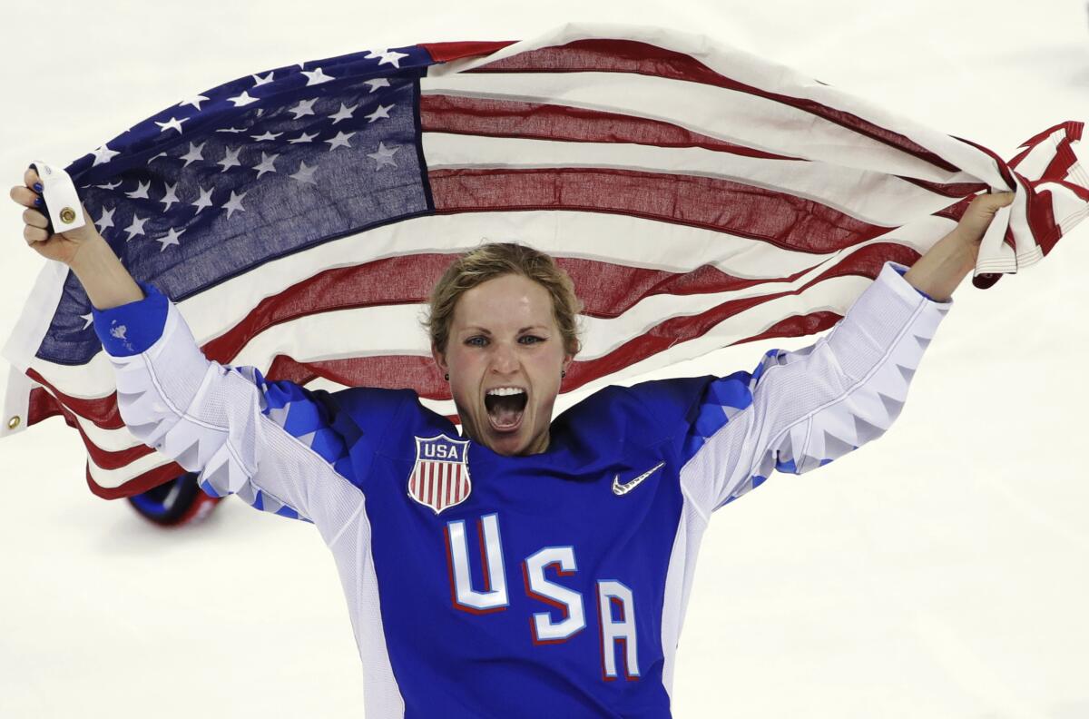 Jocelyne Lamoureux-Davidson celebrates after Team USA's victory over Canada in the gold medal game at the 2018 Winter Olympics.