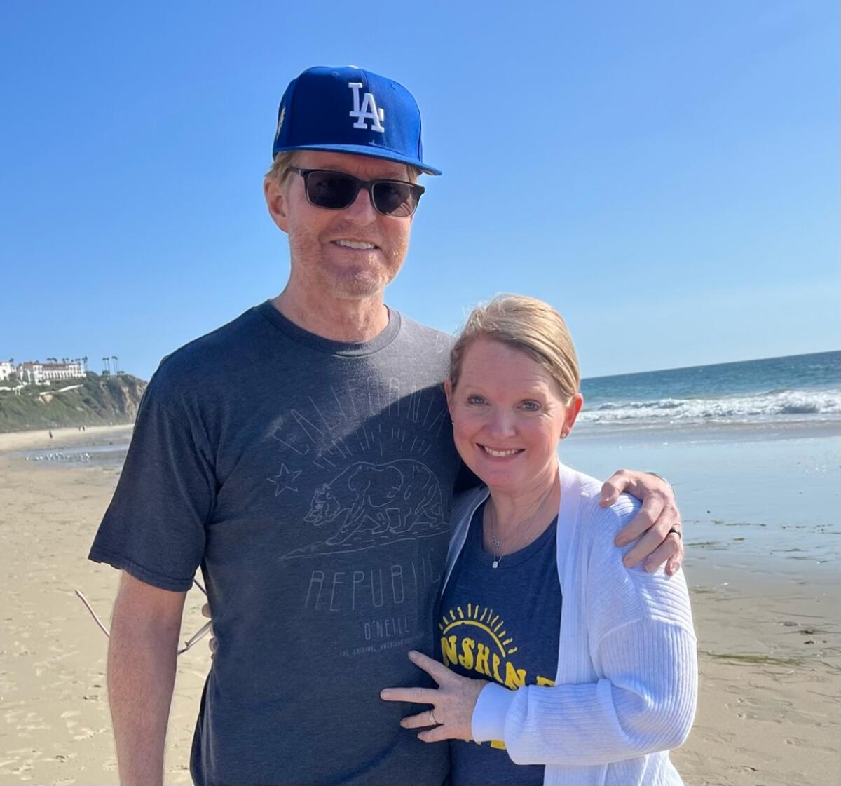 Todd Sand and wife Jenni Meno on the beach.