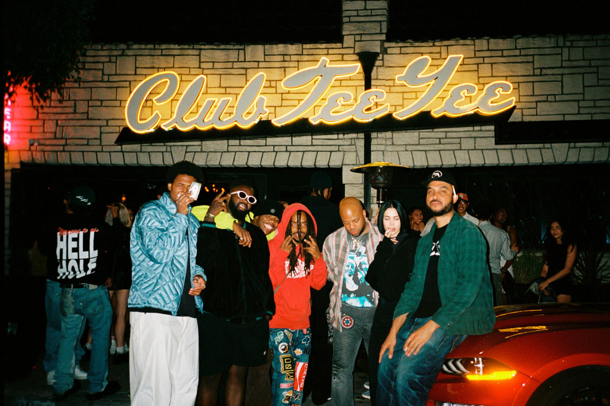 A group of friends in front of Club Tee Gee.