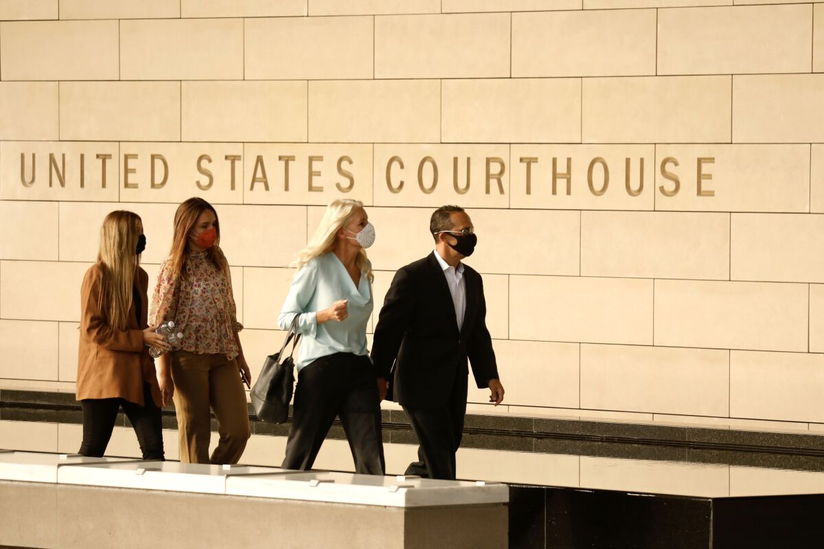 Former Los Angeles City Councilman Mitch Englander and his family arrive at the downtown Federal Courthouse in July.